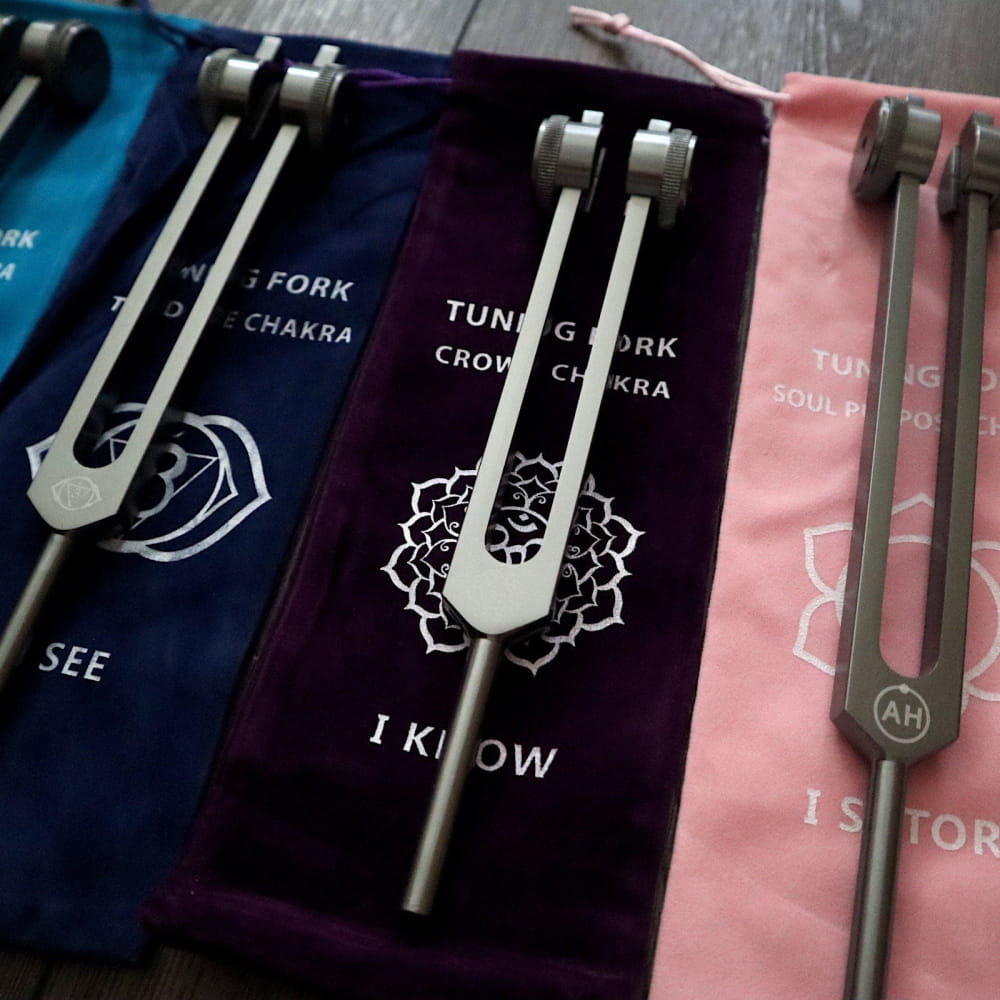 Solfeggio Tuning Fork Set with lotus mandala designs on color-coded sleeves