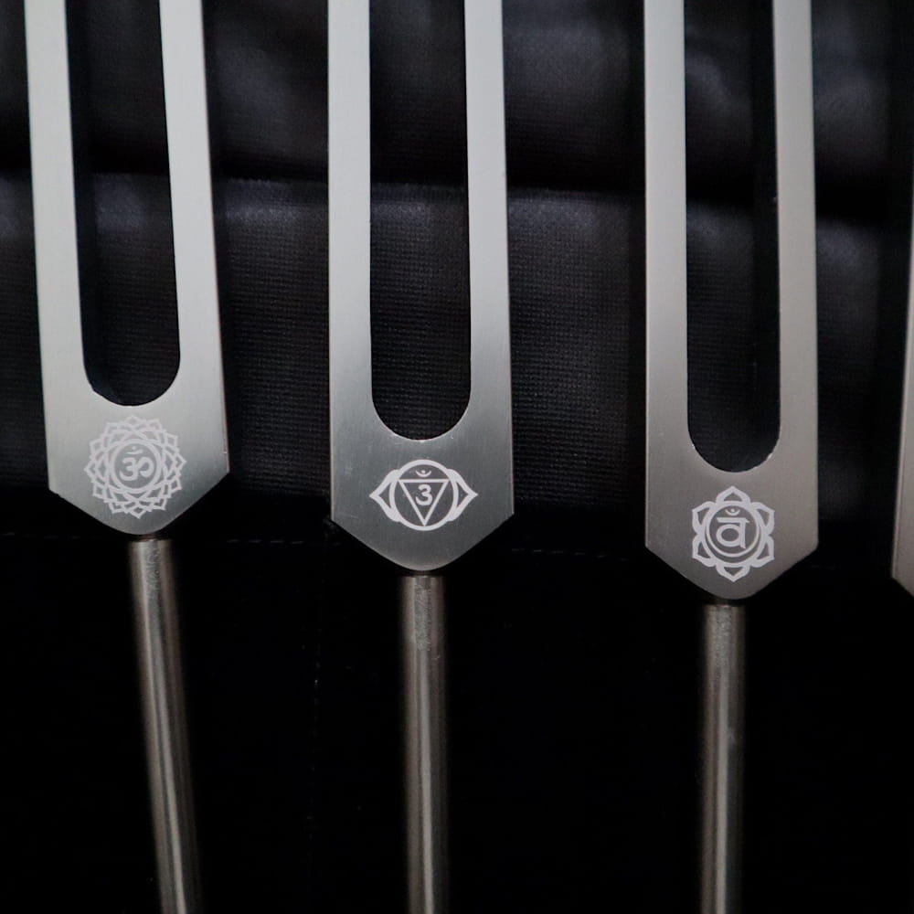 Metal tuning forks with chakra symbols for healing in Solfeggio Tuning Fork Set