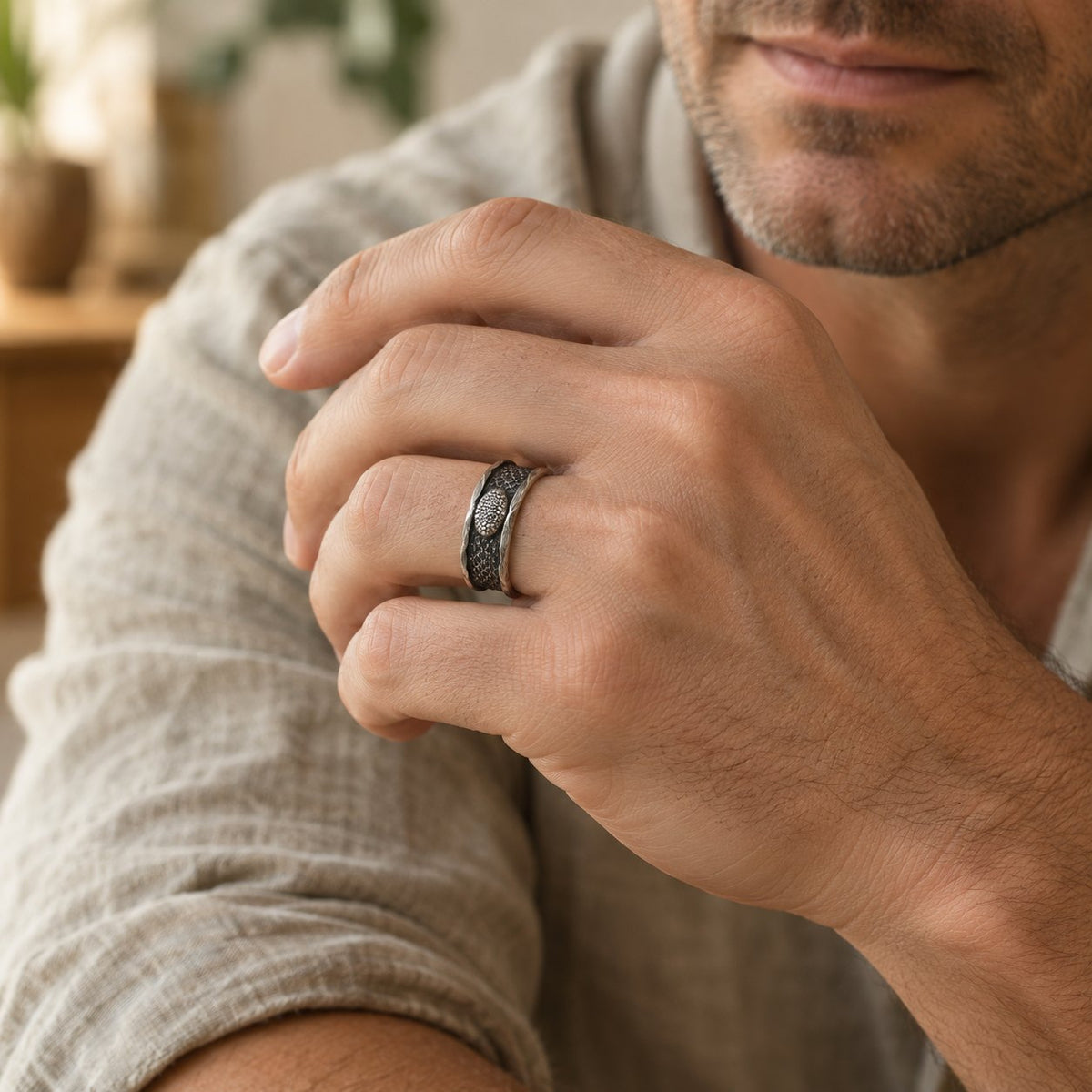 999 Sterling Silver Snake Protection Ring for Wisdom & Resilience, worn on the finger by a man