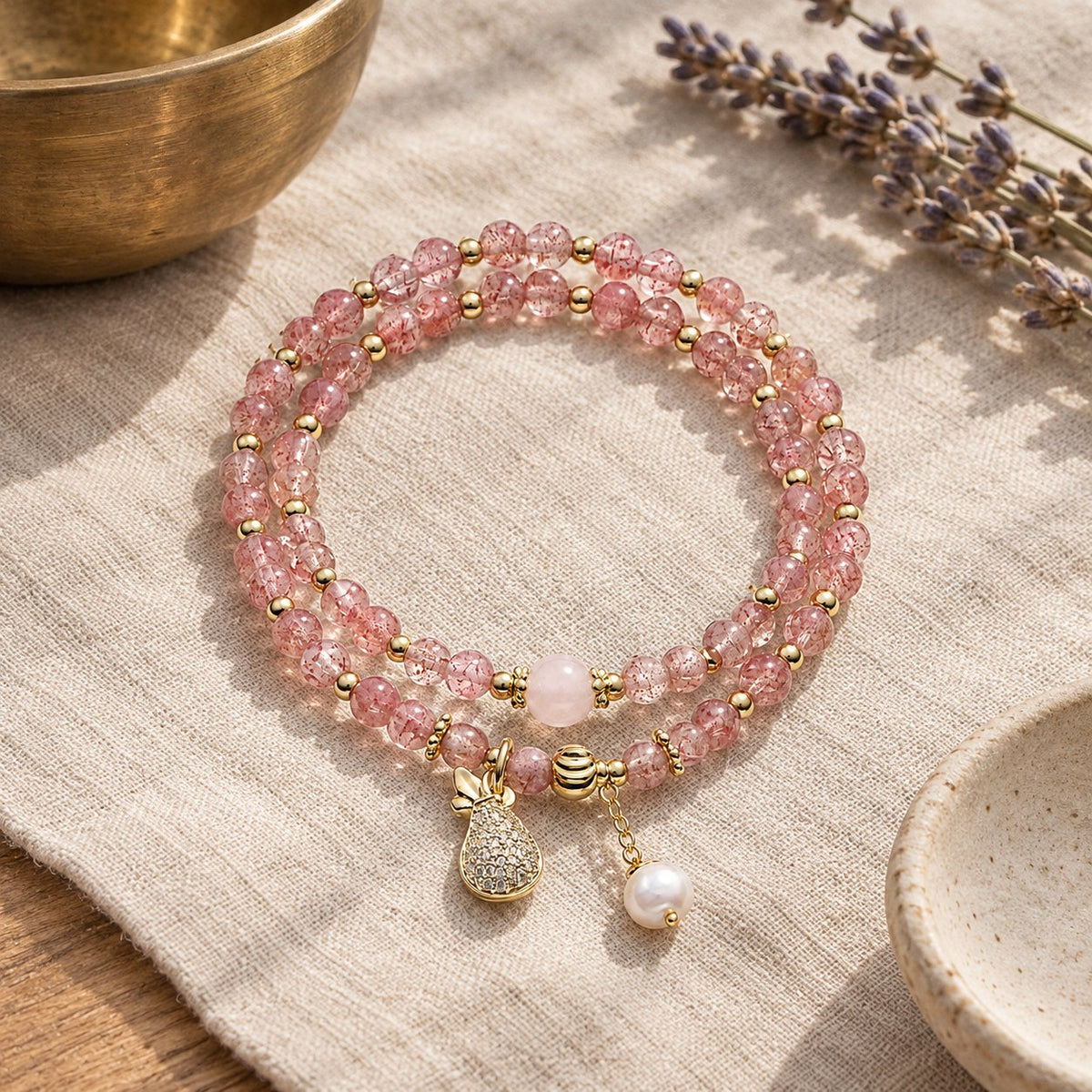 Double Wrap Strawberry Quartz Love Healing Bracelet, styled with a singing bowl and lavender