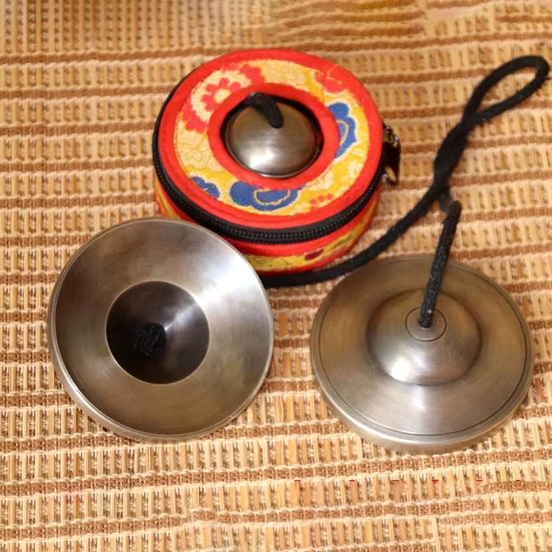 Tibetan meditation tingsha cymbals in decorative red carrying case for yoga