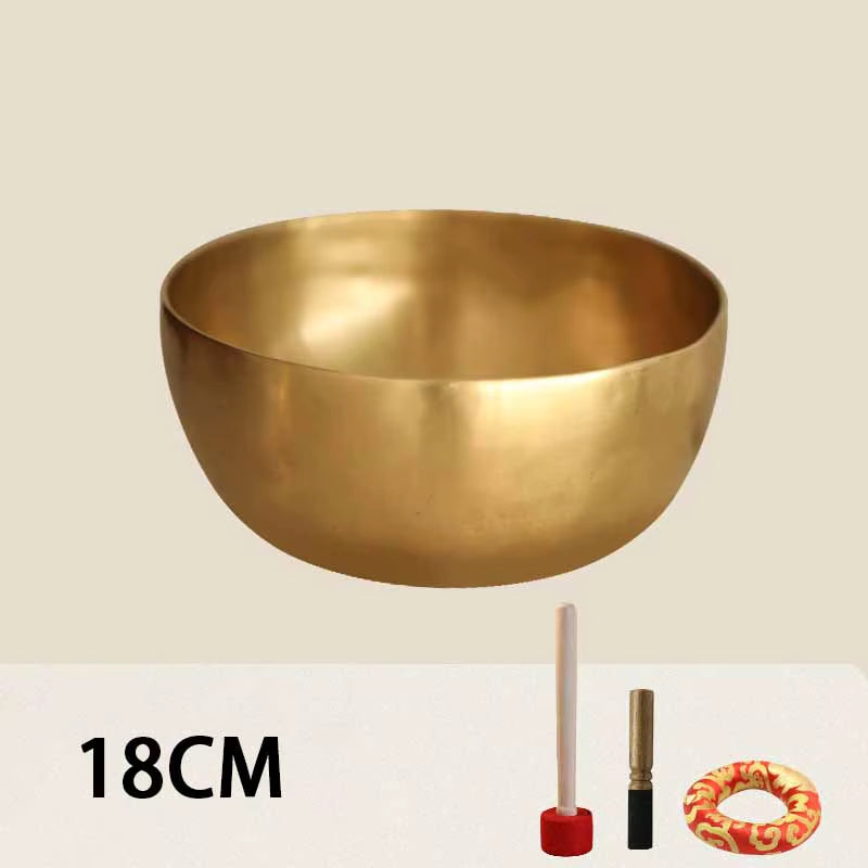 Golden brass Tibetan Buddhist singing bowl for meditation sound healing, polished finish