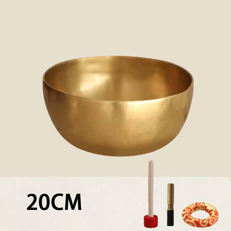 Golden metal Tibetan Buddhist singing bowl for meditation and sound healing