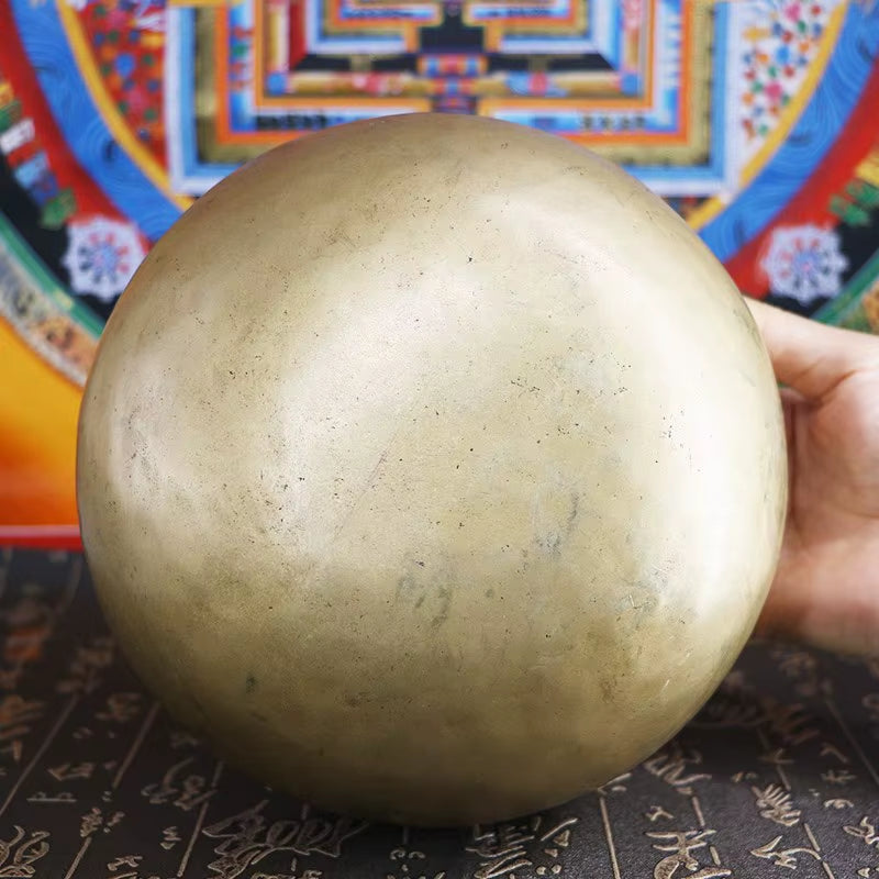 Golden metallic sphere with smooth surface for Tibetan Buddhist Bowl sound healing