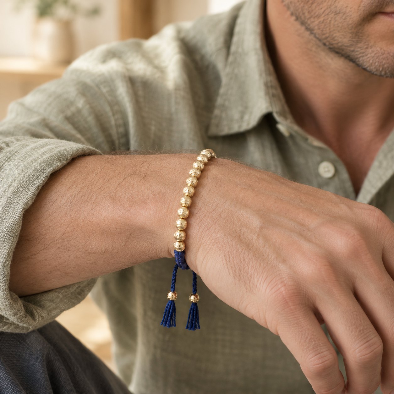 Tibetan Copper Bead Spiritual Bracelet for Luck & Balance, worn on the wrist by a man