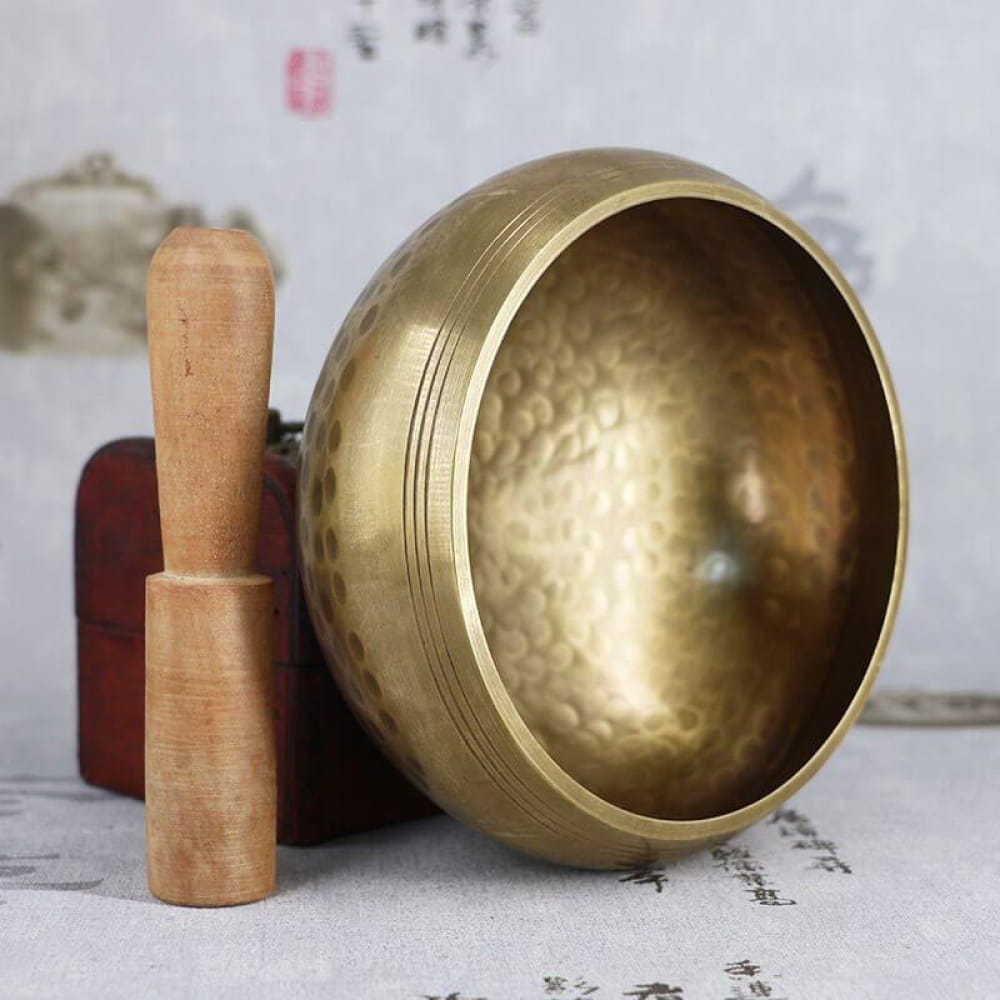 Brass Tibetan Singing Bowl with wooden striker for healing and meditation practices