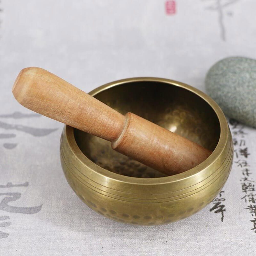 Brass Tibetan Singing Bowl with wooden striker for healing and meditation use