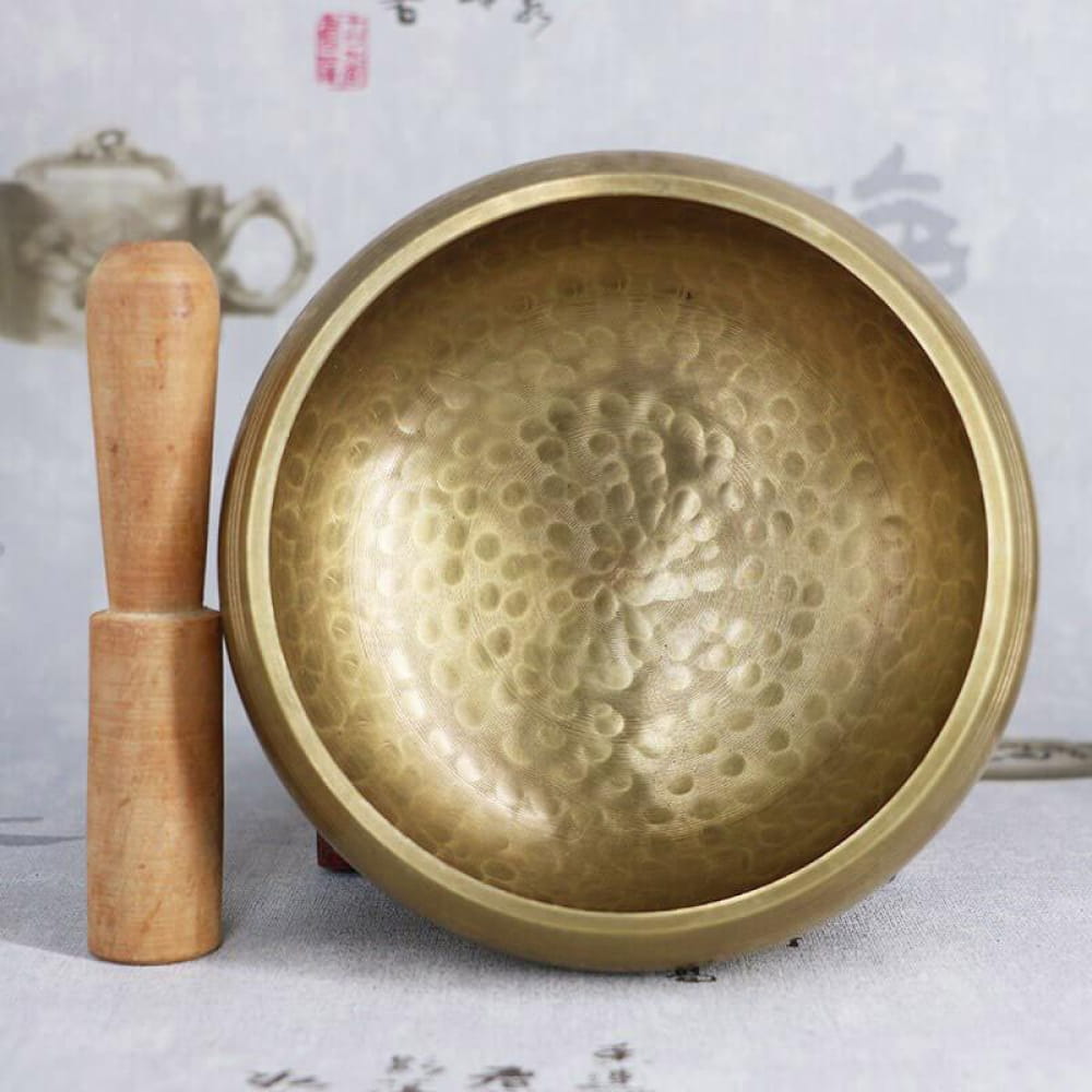 Hammered brass Tibetan Singing Bowl with wooden striker for healing and meditation