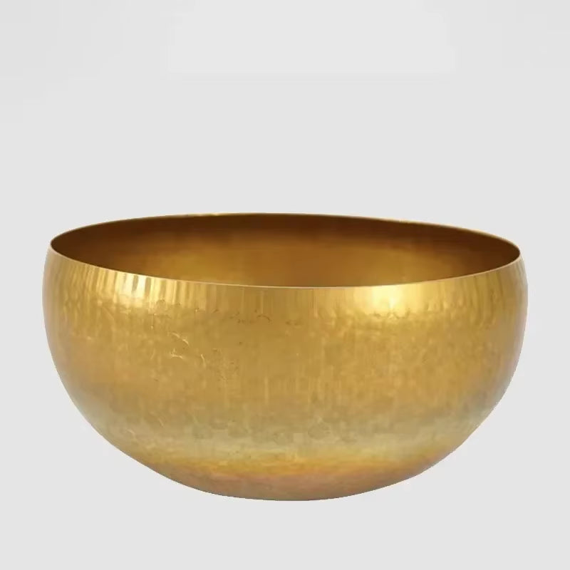 Golden metallic Tibetan Singing Bowl with smooth, rounded shape for meditation and healing