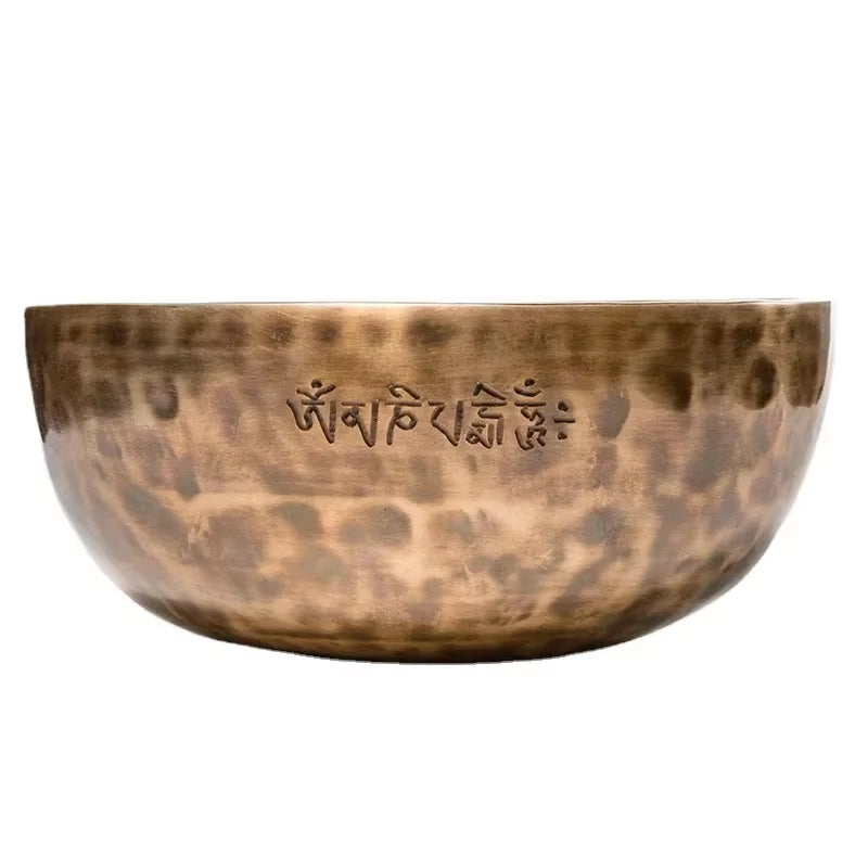 Hammered bronze Tibetan singing bowl with Sanskrit inscription for meditation and healing