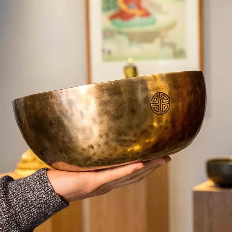 Hand-hammered brass Tibetan Singing Bowl with etched symbol design for meditation healing