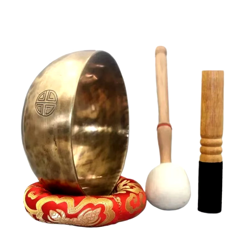 Traditional Tibetan singing bowl with striker and cushion for meditation and healing