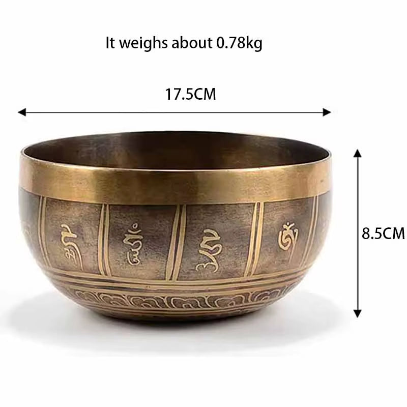 Bronze Tibetan singing bowl with etched Sanskrit symbols for healing and meditation