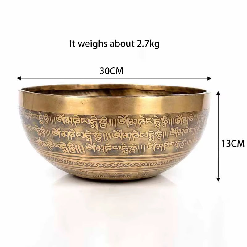 Brass Tibetan singing bowl with engraved Sanskrit text for healing and meditation