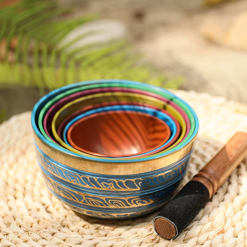 Colorful nested wooden bowls with blue and gold patterns in Tibetan Singing Bowl Set