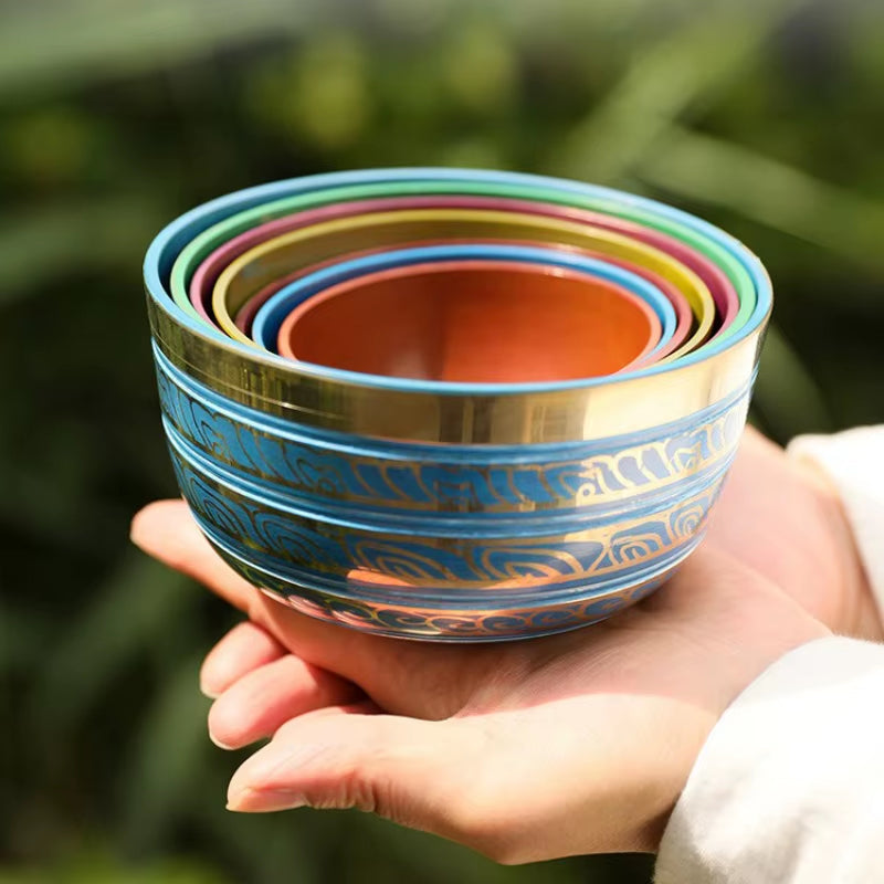 Colorful nested ceramic bowls with decorative patterns in Tibetan Singing Bowl Set for Healing