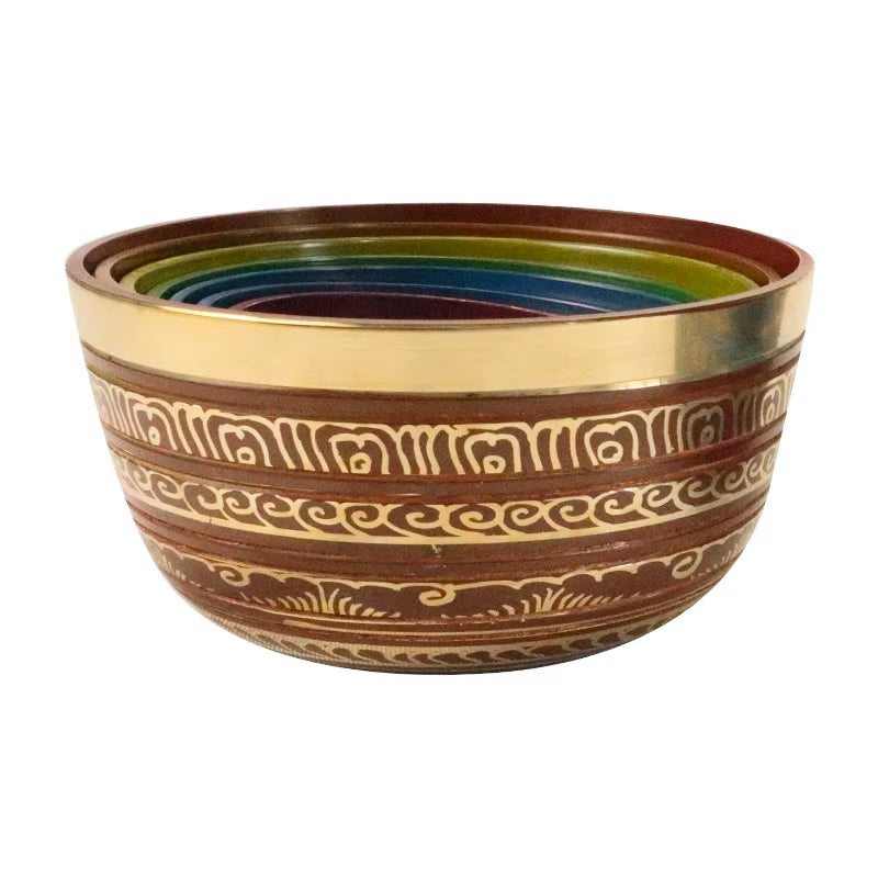 Decorative ceramic bowl with etched patterns and rainbow interior in Tibetan Singing Bowl Set