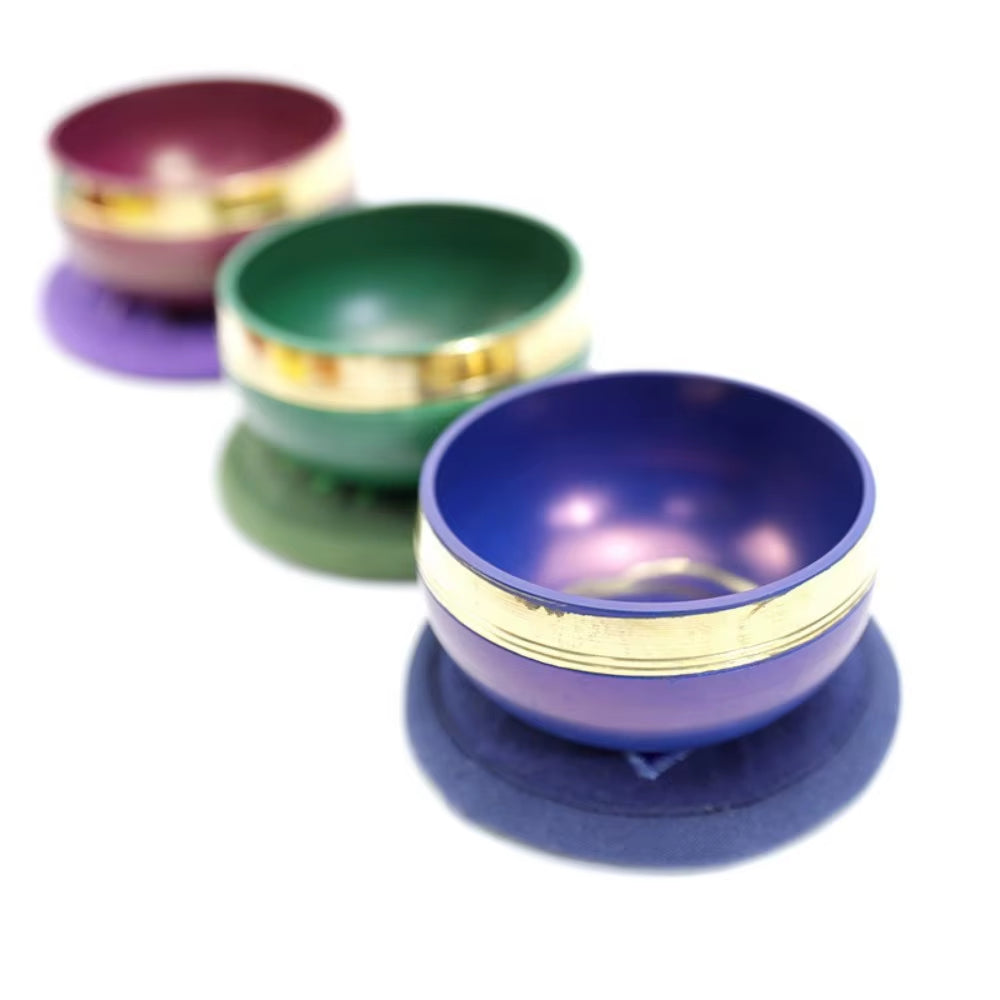 Colorful metallic Tibetan Singing Bowls with brass trim for meditation and healing