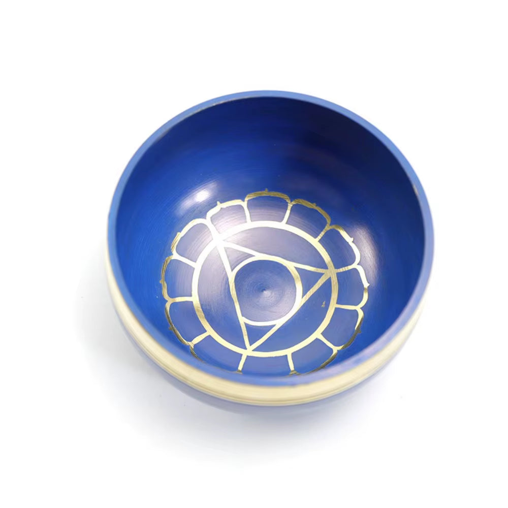 Blue ceramic bowl with gold throat chakra design in Tibetan Singing Bowl Set