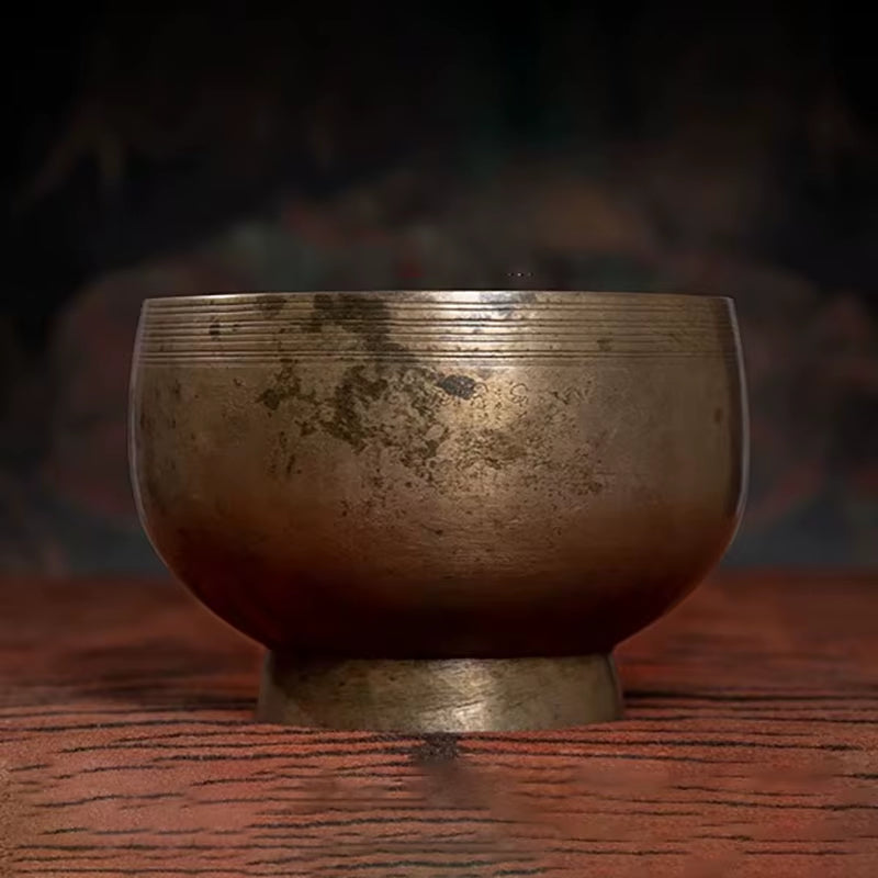 Metallic Tibetan Singing Bowl featuring circular ridges for sound healing therapy