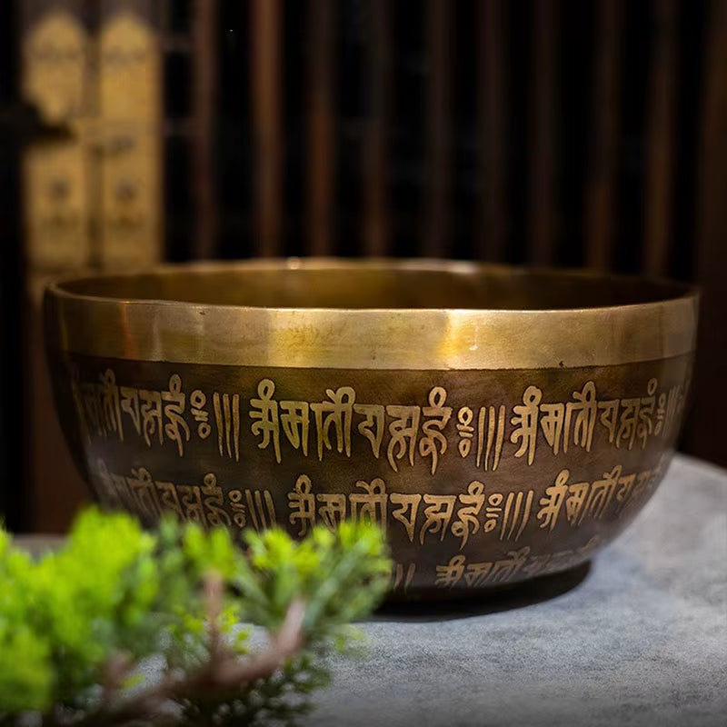 Tibetan singing bowl with Sanskrit inscriptions for meditation from Nepal