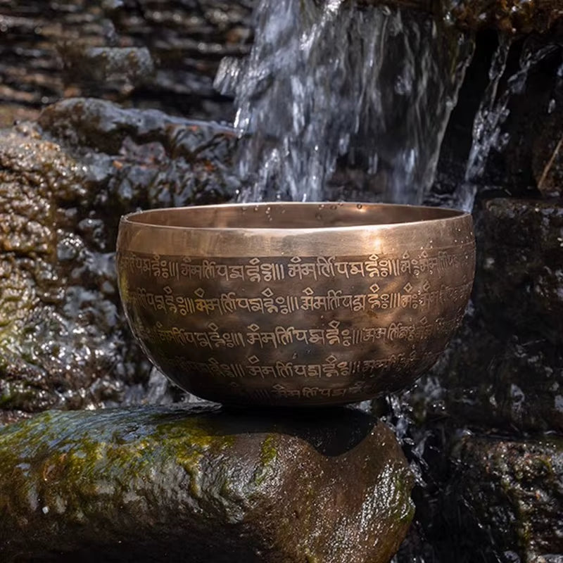 Bronze Tibetan singing bowl with inscribed Sanskrit mantras for meditation from Nepal