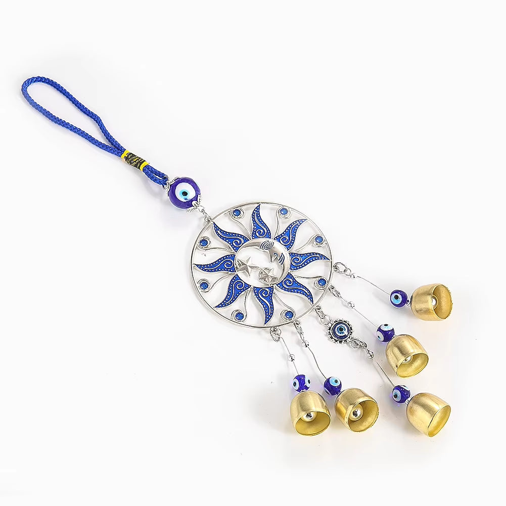 Decorative blue and white sun wall hanging with bells and evil eye beads for garden