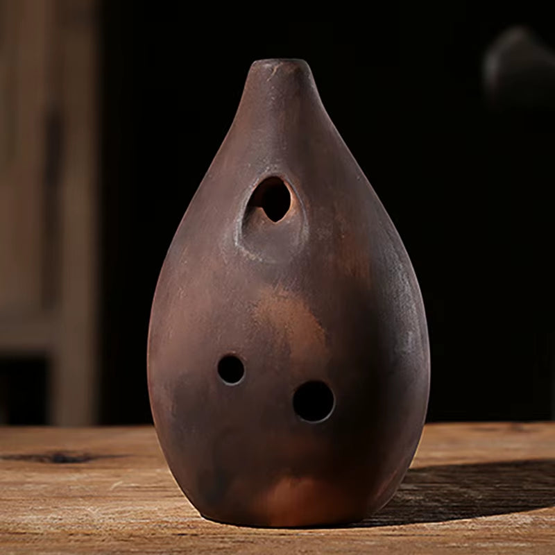 Brown Ceramic Ocarina with Three Finger Holes in Vintage Ceramic Xun Musical Instrument