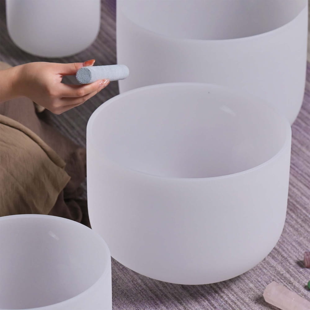 Frosted white crystal singing bowls in a beautiful 8-piece set for sound healing