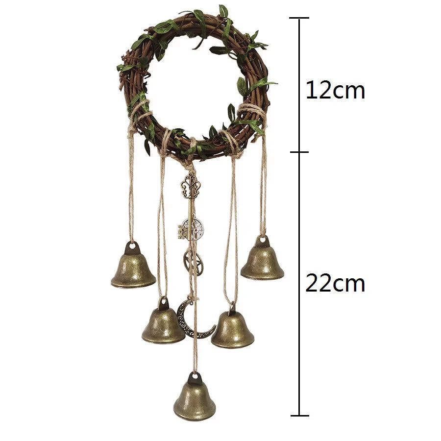 Decorative wreath with brass bells and ornaments on twine for Witch Bell Wind Chimes