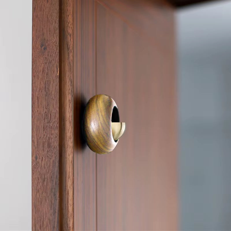 Brass doorknob on a wooden surface for Wooden Wind Chime Decorative Door Bell