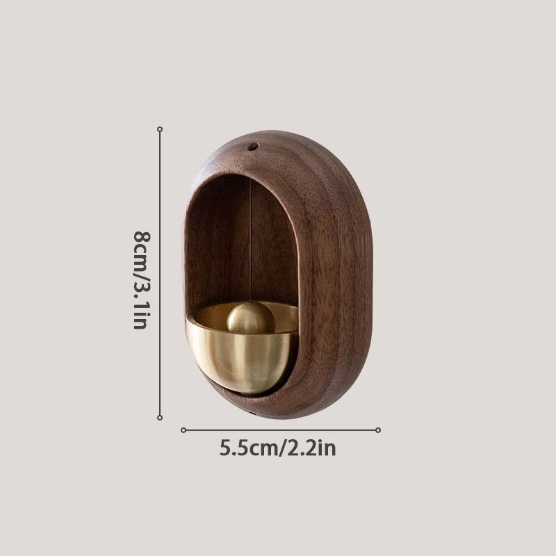 Oval wooden wall sconce with brass accent sphere in Wooden Wind Chime Decorative Door Bell
