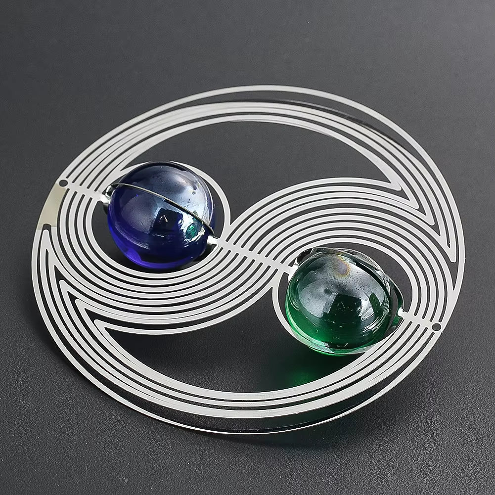 Yin-yang brooch with blue and green glass beads in silver wire design for garden spinner